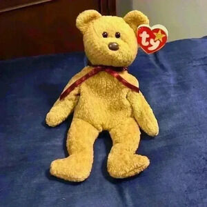 Curly the bear Ty Beanie Baby, with errors